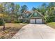 Charming two-story home featuring a two-car garage, stone accents, manicured landscaping and a walkway to the front door at 116 Edgeview Ct, Dallas, GA 30157