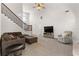 Expansive living room with vaulted ceilings, hardwood floors, modern lighting, and a cozy seating arrangement at 116 Edgeview Ct, Dallas, GA 30157