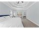 Spacious main bedroom featuring an elegant tray ceiling and large windows at 116 Edgeview Ct, Dallas, GA 30157