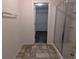 Bathroom featuring a walk-in shower and access to the walk-in closet at 3005 Stonebrook Cv, Austell, GA 30106