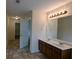 Bathroom featuring double vanity, large mirror, and tile flooring at 3005 Stonebrook Cv, Austell, GA 30106