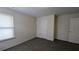 Bedroom featuring neutral carpet, white walls, and a window for natural light at 3005 Stonebrook Cv, Austell, GA 30106