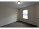 Neutral bedroom with a window and plush carpet at 3005 Stonebrook Cv, Austell, GA 30106