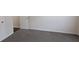 Bedroom featuring neutral carpet, white walls, and a view into the hallway at 3005 Stonebrook Cv, Austell, GA 30106
