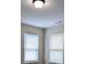 A modest bedroom featuring dual windows that allow ample light at 3005 Stonebrook Cv, Austell, GA 30106