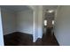 Entry way featuring dark wood-look flooring and a clear sight line to the back at 3005 Stonebrook Cv, Austell, GA 30106