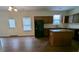 Open-concept kitchen featuring granite countertops, a center island, and stainless steel appliances at 3005 Stonebrook Cv, Austell, GA 30106