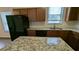 Kitchen featuring granite countertops, wood cabinets, and stainless steel appliances at 3005 Stonebrook Cv, Austell, GA 30106