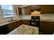 Well-lit kitchen featuring granite countertops, stainless steel appliances, and ample cabinet space at 3005 Stonebrook Cv, Austell, GA 30106