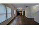 Open-concept living room showcasing wood-look floors and easy access to the kitchen at 3005 Stonebrook Cv, Austell, GA 30106