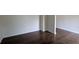 Open living room with wood-look floors and neutral walls, perfect for relaxing or entertaining at 3005 Stonebrook Cv, Austell, GA 30106