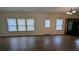 Spacious living room featuring multiple windows for natural lighting at 3005 Stonebrook Cv, Austell, GA 30106