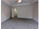 Spacious main bedroom featuring tray ceiling and plush carpet at 3005 Stonebrook Cv, Austell, GA 30106