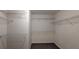 Spacious walk-in closet with multiple shelves for optimal organization at 3005 Stonebrook Cv, Austell, GA 30106