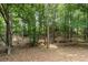 Picturesque backyard featuring mature trees, and natural landscape providing a private, wooded retreat at 3335 Maple Terrace Dr, Suwanee, GA 30024