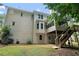 Backyard with a deck, wooden stairs, screened-in porch, and well-manicured landscaping at 3335 Maple Terrace Dr, Suwanee, GA 30024