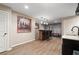 Spacious basement offers wet bar, home gym area, and room for entertaining with luxury vinyl floors at 3335 Maple Terrace Dr, Suwanee, GA 30024