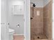 Bathroom features a tiled shower with a built-in niche and a convenient toilet area at 3335 Maple Terrace Dr, Suwanee, GA 30024
