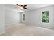 Spacious bedroom with two large windows offering ample natural light and scenic views at 3335 Maple Terrace Dr, Suwanee, GA 30024