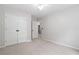 Bedroom featuring neutral carpet, closet, and access to adjoining room at 3335 Maple Terrace Dr, Suwanee, GA 30024