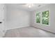 Bright bedroom features plush carpeting and large windows offering abundant natural light at 3335 Maple Terrace Dr, Suwanee, GA 30024