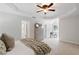 Bright bedroom with plush carpeting, a tray ceiling, and a decorative dresser at 3335 Maple Terrace Dr, Suwanee, GA 30024