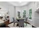 Cozy breakfast nook featuring a round glass table with four chairs and bay windows offering bright light at 3335 Maple Terrace Dr, Suwanee, GA 30024