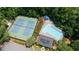 Aerial photo showcasing a sparkling community pool and tennis courts, perfect for outdoor activities at 3335 Maple Terrace Dr, Suwanee, GA 30024