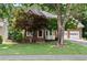 Charming two-story brick home featuring an attached two-car garage and a beautifully landscaped front yard at 3335 Maple Terrace Dr, Suwanee, GA 30024