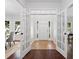 Inviting foyer with tile floors and glass French doors that let in light at 3335 Maple Terrace Dr, Suwanee, GA 30024