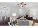 Open living room featuring hardwood floors, plush seating, and plenty of natural light at 3335 Maple Terrace Dr, Suwanee, GA 30024