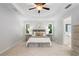 Main bedroom features a tray ceiling, a ceiling fan, and plenty of natural light at 3335 Maple Terrace Dr, Suwanee, GA 30024