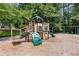 Community playground with multiple play structures including slides, climbing walls and swings at 3335 Maple Terrace Dr, Suwanee, GA 30024