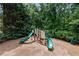 Playground featuring slides and climbing structures in a mulched play area, great for  at 3335 Maple Terrace Dr, Suwanee, GA 30024