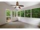 Cozy sunroom filled with natural light and a view of the lush green trees at 3335 Maple Terrace Dr, Suwanee, GA 30024