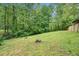 The property includes a large grassy backyard, perfect for outdoor activities and relaxation at 71 Anita Se Pl, Mableton, GA 30126