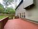An elevated deck overlooks a lush backyard, adjacent to the home at 71 Anita Se Pl, Mableton, GA 30126