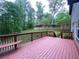 An elevated deck overlooks a lush backyard with mature trees at 71 Anita Se Pl, Mableton, GA 30126