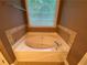 This bathroom showcases a soaking tub below a window, creating a spa-like atmosphere at 71 Anita Se Pl, Mableton, GA 30126