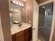 Bathroom features include a wood vanity, framed mirror, and tiled floors at 71 Anita Se Pl, Mableton, GA 30126