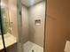 This bathroom boasts a walk-in shower with sleek tile work and a glass door at 71 Anita Se Pl, Mableton, GA 30126