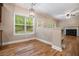 Cozy dining area with hardwood floors and an elegant chandelier with natural light at 71 Anita Se Pl, Mableton, GA 30126