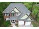 An aerial view of this two-story home showing the roof, two-car garage, and landscaping at 71 Anita Se Pl, Mableton, GA 30126