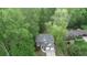 Charming two-story home with a two-car garage and landscaped front yard surrounded by mature trees at 71 Anita Se Pl, Mableton, GA 30126