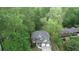Charming two-story home with a two-car garage and landscaped front yard surrounded by mature trees at 71 Anita Se Pl, Mableton, GA 30126
