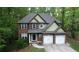 Beautiful two-story brick home with a well-maintained lawn and a two-car garage at 71 Anita Se Pl, Mableton, GA 30126