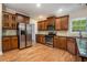 Modern kitchen with stainless steel appliances, dark cabinets, and granite countertops at 71 Anita Se Pl, Mableton, GA 30126