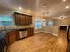 Open kitchen with dark cabinets, stainless steel appliances, and breakfast bar overlooking the living space at 71 Anita Se Pl, Mableton, GA 30126