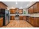 Spacious kitchen with stainless steel appliances, dark cabinets, and tiled backsplash at 71 Anita Se Pl, Mableton, GA 30126