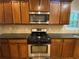The kitchen features stainless steel appliances and dark countertops at 71 Anita Se Pl, Mableton, GA 30126
